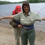 This one is Robin Reilly, Quetico Park Superintendent, trying to turn Lisa into a Voyageur at the Fall Lake event, July 9th.