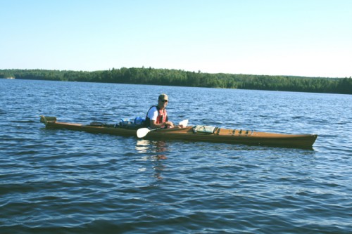 Solo kayaker on the Loon River (unidentified) headed north to International Falls